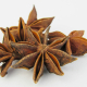 a group of star anise on a white background